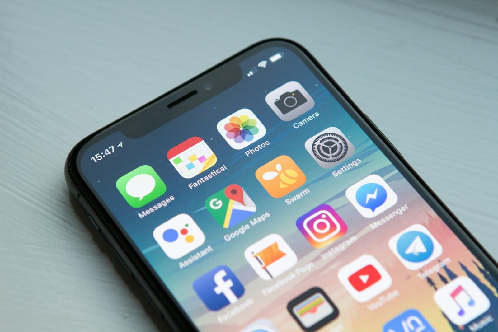 A smartphone home screen filled with apps